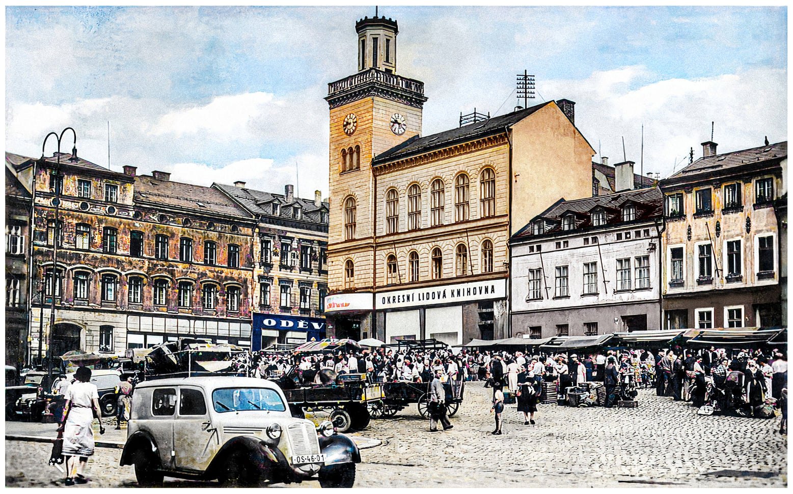 Vintage Jablonec square with the town-hall clock tower and market