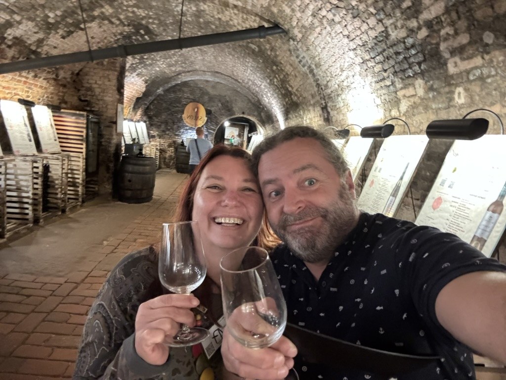 Keith and Simi with a glass of wine