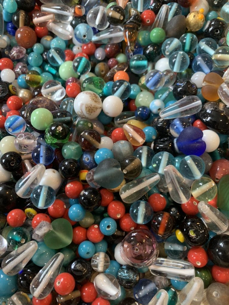 A colourful pile of mixed glass beads