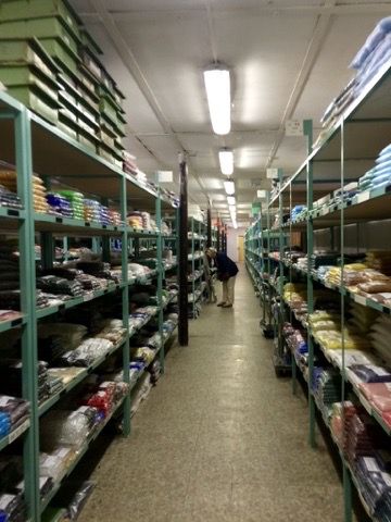 Shopping aisle of bead shelves