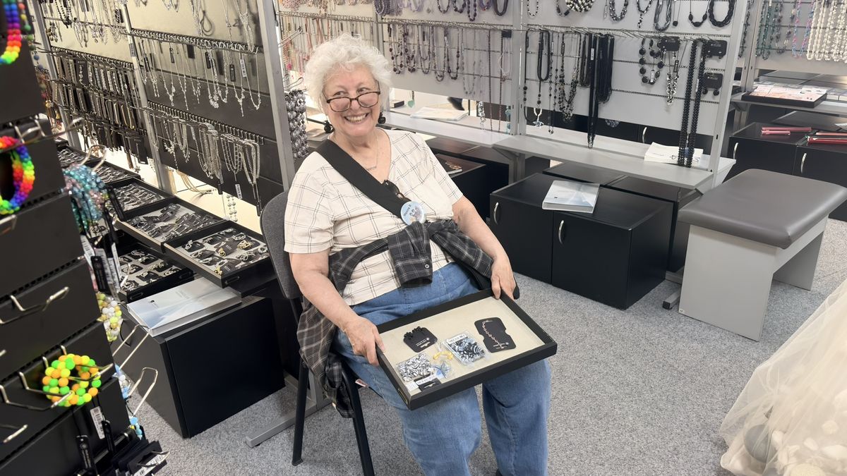 A quiet rest between shops — still smiling